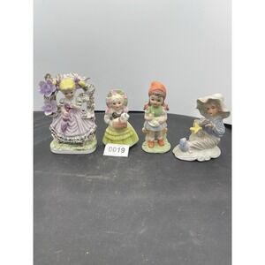 Four vintage children figurines